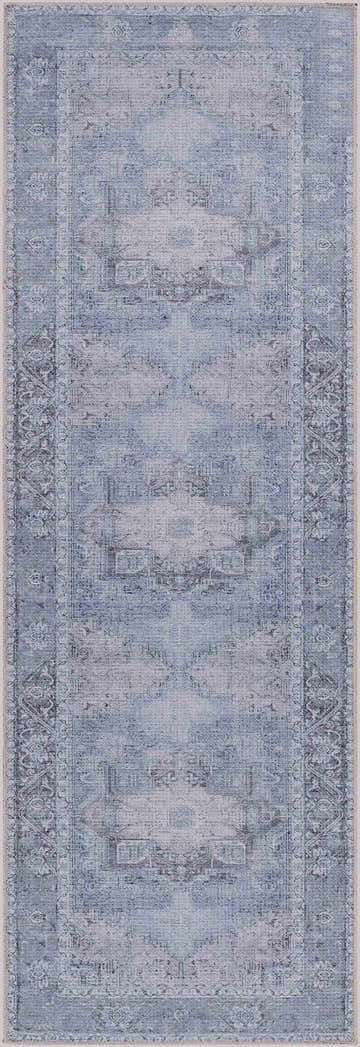 Close-up of the Ice Blue Flat Pile Washable Rug. Features a vintage-inspired pattern in cream, gray, and sky blue tones. Design-Runner-2773