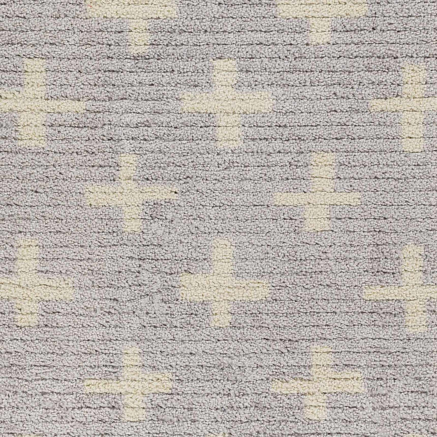 Close-up of the Anda Area Rug, featuring a textured ivory plus sign pattern on a medium gray base. Swatch