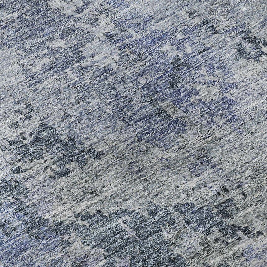 Close-up of Dalyn Luxury Bresca BC6 Blue Washable Area Rug. Features denim, light blue, and silver gray tones.