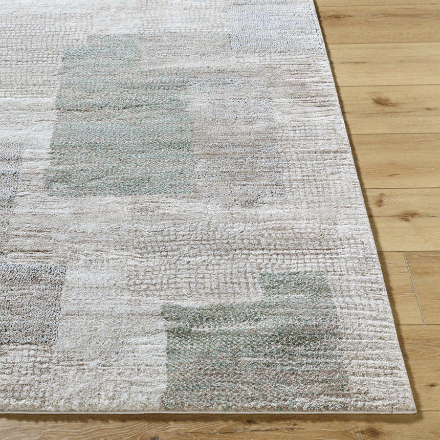 Close up of the Anaisa Ivory Luxe Thick Area Rug showing its ivory, sage, and tan geometric design. Front