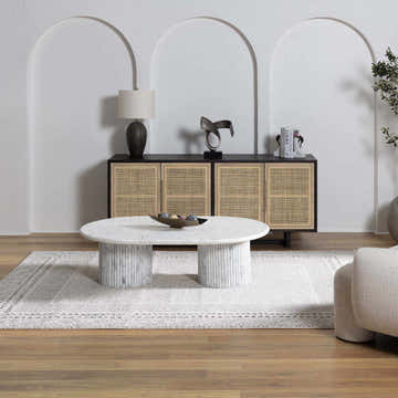 Living room scene with a charcoal and off-white Burdette area rug under a marble coffee table. Farmhouse style. Roomscene-Rectangle
