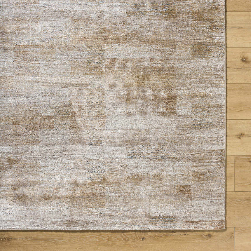 Close-up of the Bridie Luxe Thick Area Rug showing ivory, peach, and tan colors and soft, textured pile on wood floor. Swatch