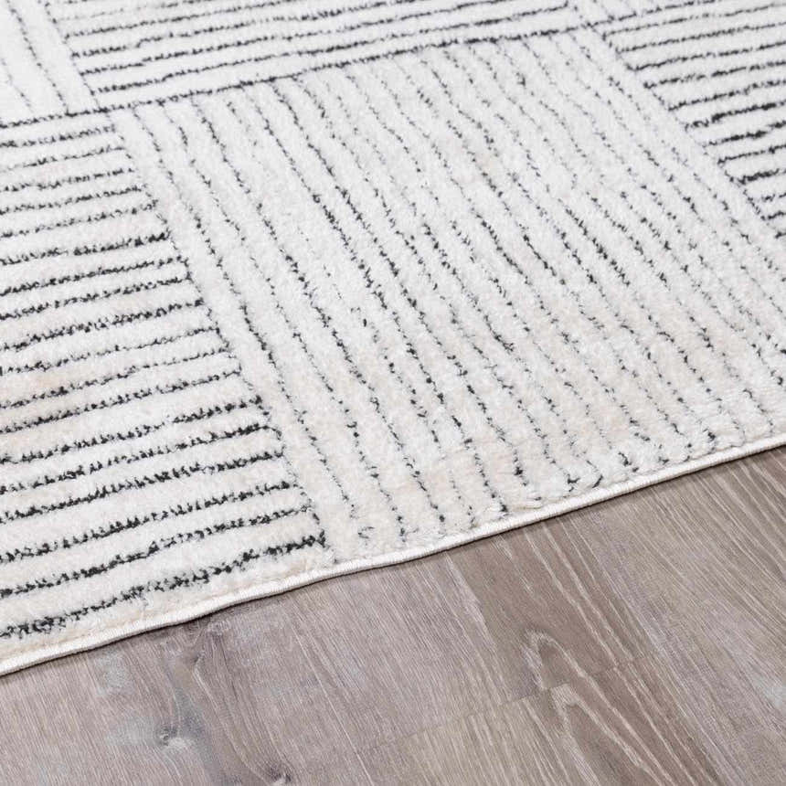 Close up of the Modern Scandi Architect I Area Rug, ivory high pile with black geometric line pattern. Pile