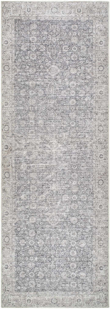 Close-up of the Spokane Gray Area Rug. Machine woven polyester rug in charcoal, dark brown, and off-white with farmhouse style pattern. Design-Runner-2673