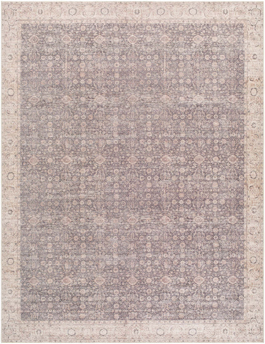 Close-up of the Spokane Machine Woven rug featuring a traditional floral pattern in charcoal, ivory, and tan. Design-Rectangle