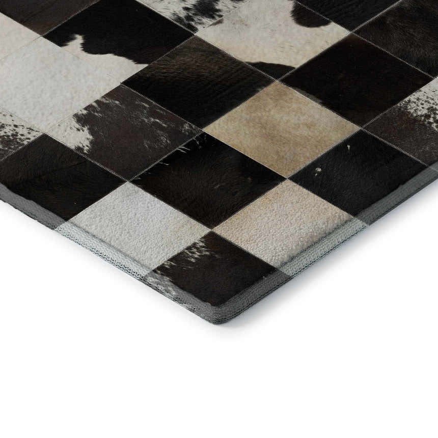 Close up of the Dalyn Luxury Bozeman BM10 Black Washable Area Rug, showing black, beige, and chestnut diamond patchwork design.