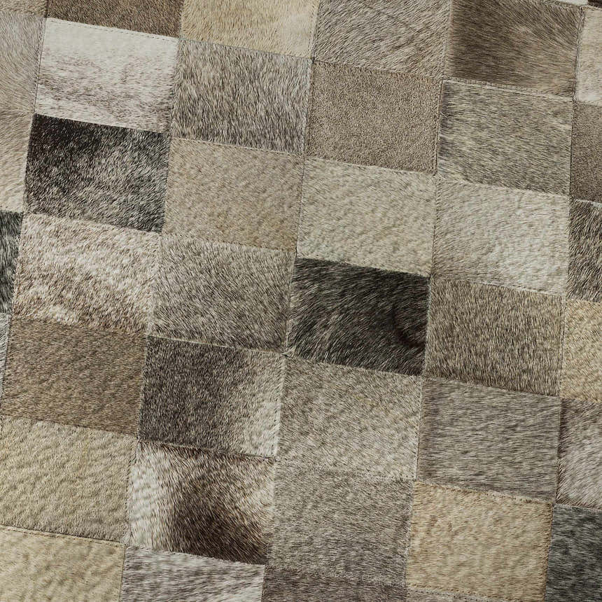 Close-up of Dalyn Luxury Indoor/Outdoor Bozeman BM2 Gray Washable Area Rug with beige, black, and taupe patchwork design.