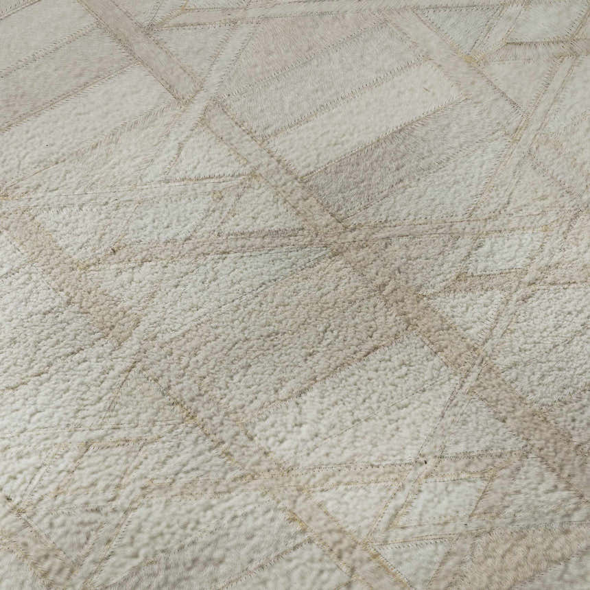 Close-up of the Dalyn Luxury Bozeman BM4 Linen Washable Area Rug. Beige, chestnut, and taupe lodge style rug with geometric pattern.
