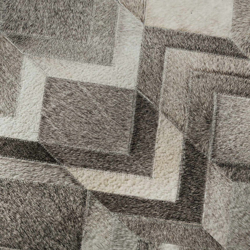 Close-up of Dalyn Luxury Bozeman BM5 Gray Washable Area Rug. Features beige, black, and taupe geometric patchwork design.
