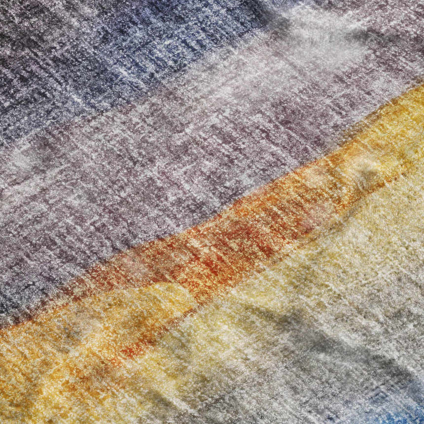 Close-up of the Dalyn Luxury Boca BO4 Blue Washable Area Rug showing its beige, gold, and blue textured design.