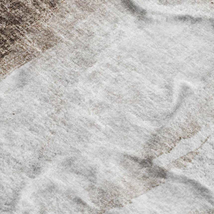Close-up of the soft texture and beige, caramel, and ivory colors of the Dalyn Luxury Boca BO7 Taupe Washable Area Rug.