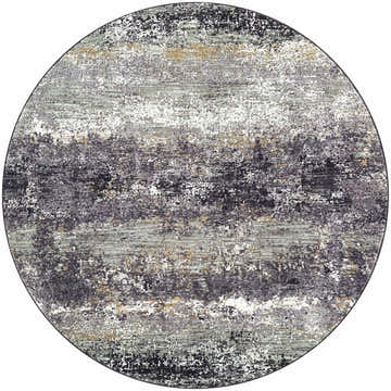 Close-up of a round Behzad Medium Gray Area Rug. Features a Southwestern-inspired pattern in black, charcoal, gray, ivory, and tan. Design-Round-53