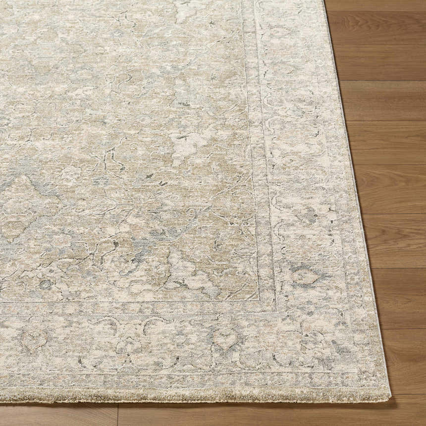 Close up of Brynja Cream Area Rug showing traditional pattern and texture on hardwood floor. Front