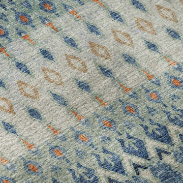 Close-up of Dalyn Brisbane BR1 Indigo Washable Area Rug. Features burnt, navy, teal, and taupe geometric design.
