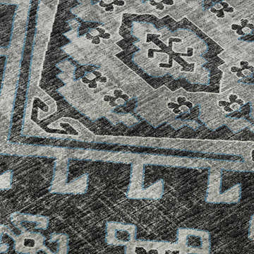 Close-up of the Dalyn Brisbane BR2 Midnight Washable Area Rug. Features beige, navy, and black geometric patterns.
