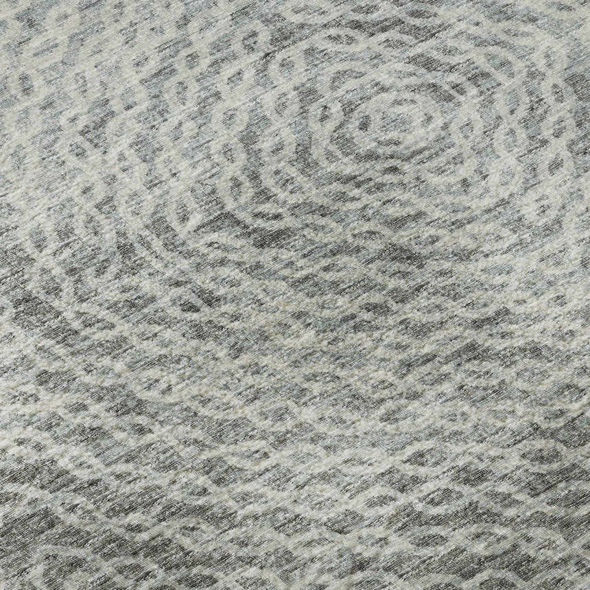 Close-up of the Dalyn Brisbane BR3 Metal Washable Area Rug, showing a beige, silver gray, and taupe geometric pattern.