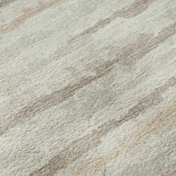 Close-up of the Dalyn Brisbane BR4 Linen Washable Area Rug, showing its beige, ivory, and light brown stripe pattern.