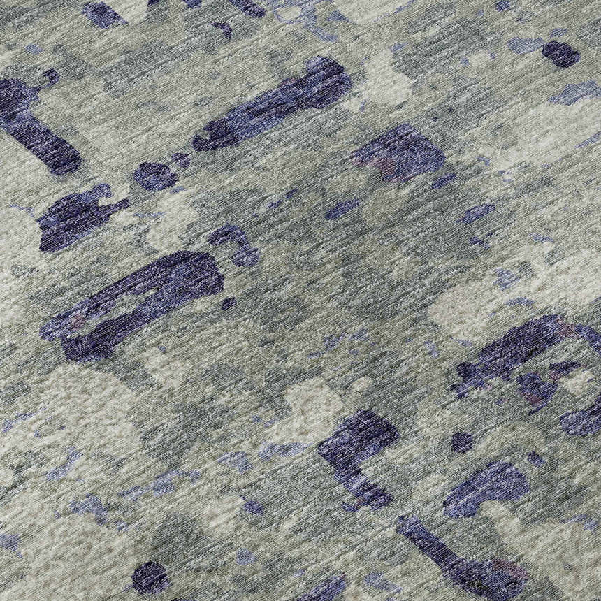 Close-up of the Dalyn Brisbane BR5 Eggplant Washable Area Rug. Features a taupe background with dark purple abstract shapes.