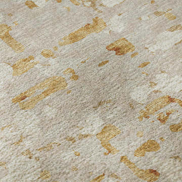 Close-up of Dalyn Brisbane BR5 Khaki Washable Area Rug. Beige rug with gold, light brown, and taupe abstract pattern.