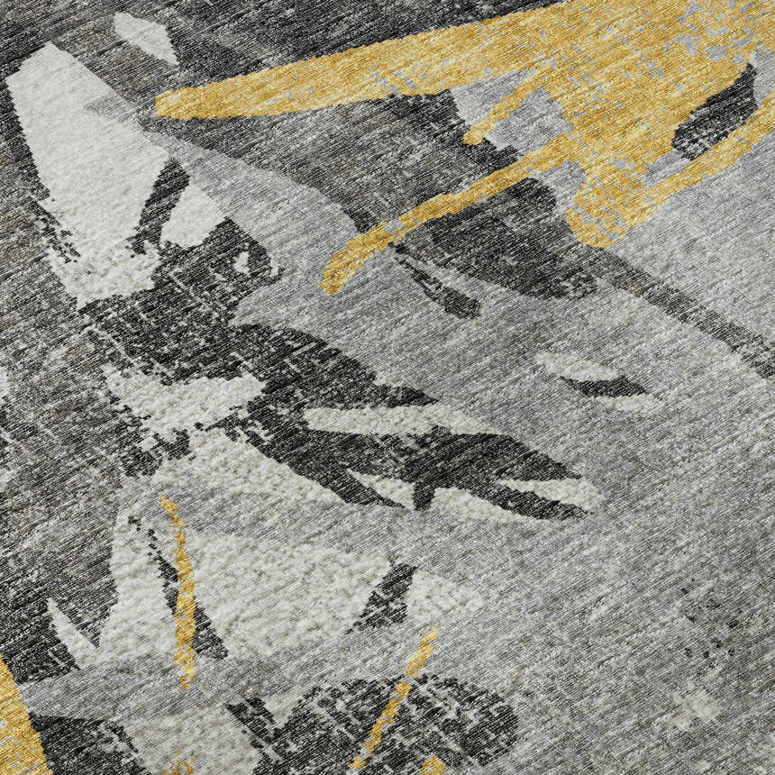 Close-up of Dalyn Brisbane BR6 Gold Washable Area Rug. Abstract pattern in gold, taupe, and yellow. Machine-made texture.