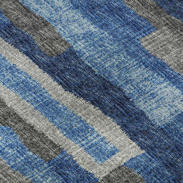 Close-up of Dalyn Brisbane BR7 Navy Washable Area Rug. Denim, navy, and taupe hues in a casual, textured, geometric pattern.