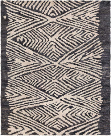 Close-up of the Bradshaw Clearance Jute Rug. Hand-woven rug with black and ivory geometric pattern and natural jute texture. Design-Rectangle-810