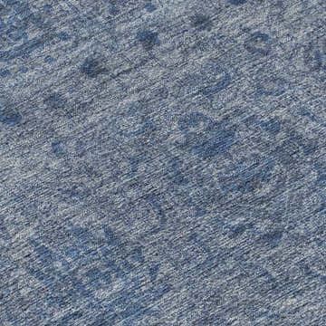 Close-up of the Dalyn Luxury Burano BU8 Blue Washable Area Rug. Denim, light blue, and silver gray textured pattern.