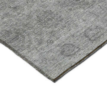 Close-up of the textured Dalyn Luxury Burano BU8 Gray Washable Area Rug. Silver gray and taupe tones.