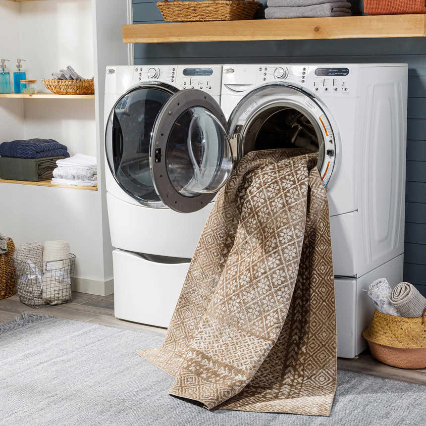 Laundry room scene with Caditaan Washable Area Rug in brown and cream coming out of a washing machine. Washing-Machine