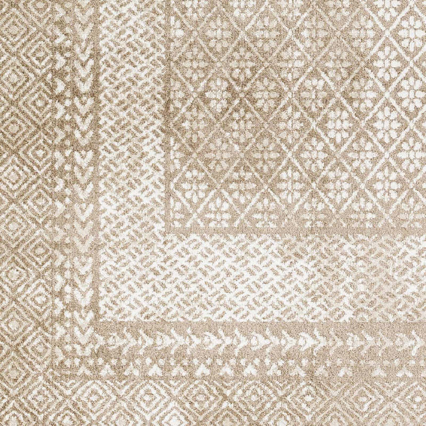 Close-up of the Caditaan Washable Area Rug. Brown, cream, and light beige geometric and floral pattern. Machine woven texture. Swatch