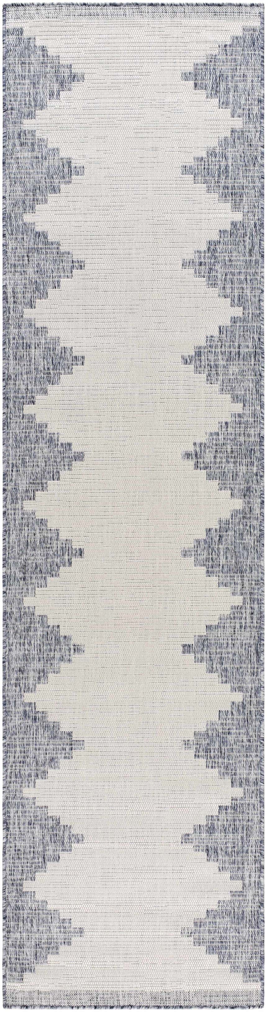 Close-up of the Djugun Blue Outdoor Rug, featuring a geometric blue and off-white pattern with a textured weave. Design-Runner-2710