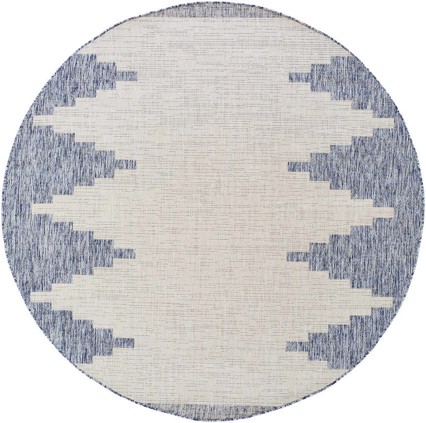 Close-up of a round Djugun Blue Outdoor Rug. The rug has a geometric pattern in blue and off-white. Design-Round-67