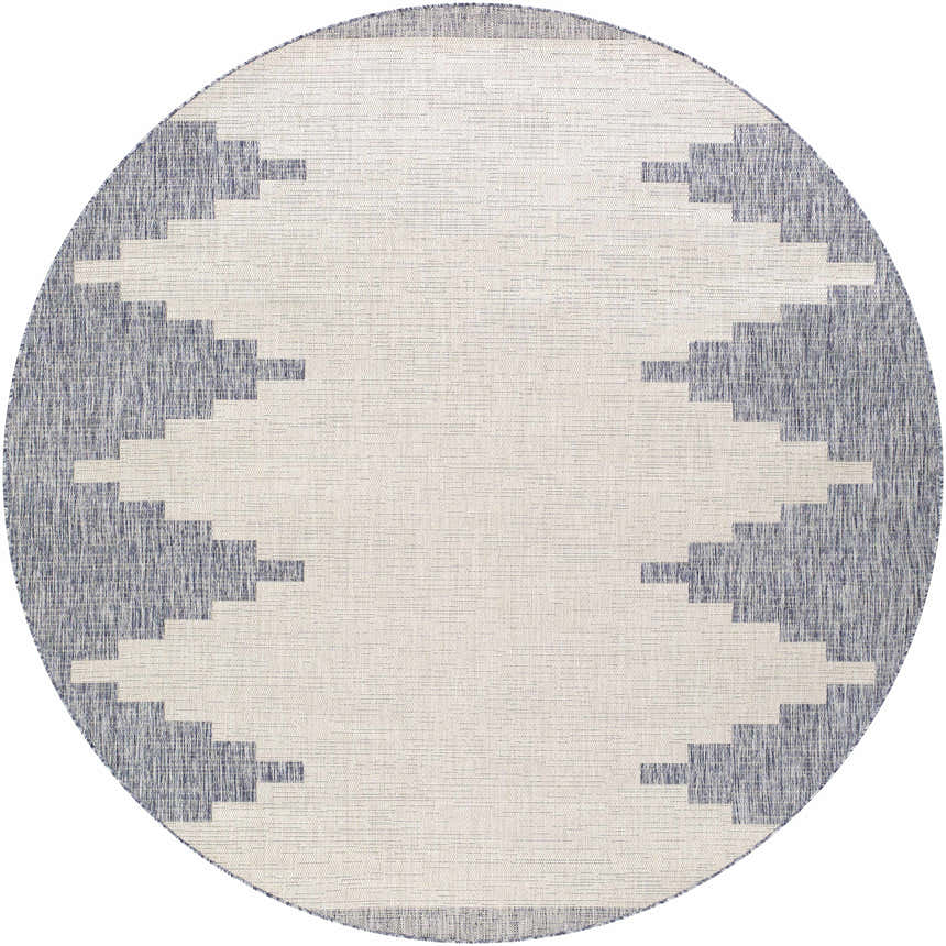 Close-up of round Djugun Blue Outdoor Rug. Oatmeal center with navy geometric pattern around the edge. Design-Round-710