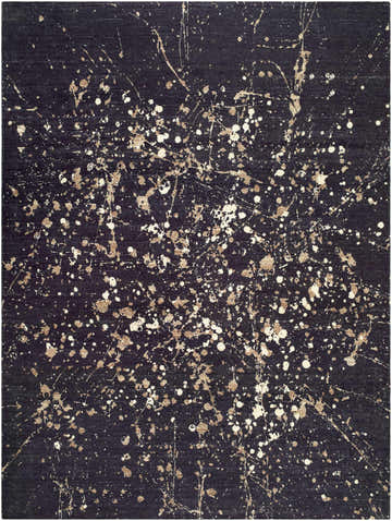 Close-up of the Janek I Modern Abstract Area Rug featuring a black background with white and tan splatter paint design. Design-Rectangle-810