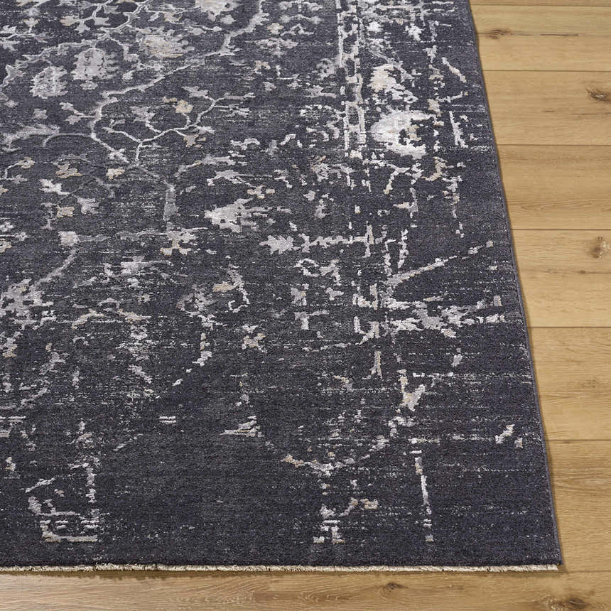 Close-up of the Corina Black Area Rug showing its charcoal, gray, and ivory traditional design and soft texture. Front