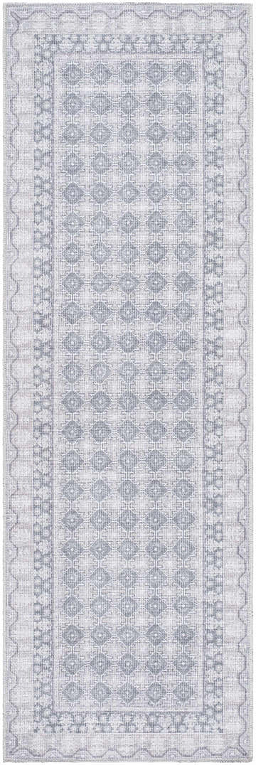 Close-up of the Rainier Blue Washable Rug. Features a pale blue geometric pattern and traditional border design. Design-Runner-27710