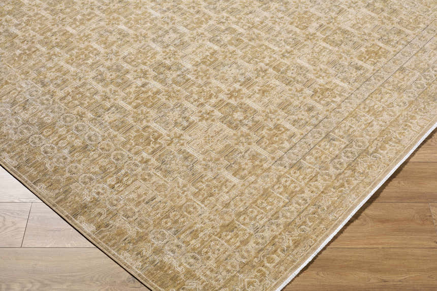 Close up of Becki Tan Owens x Livabliss Renaissance Area Rug. Beige, tan, and taupe traditional farmhouse pattern. 100% wool. Corner