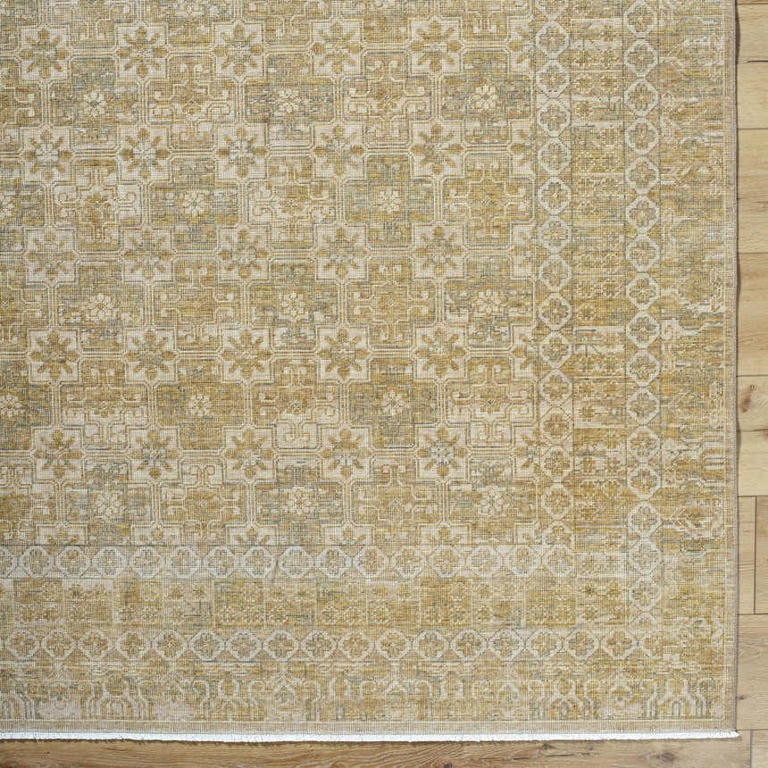 Close-up of Becki Tan Owens x Livabliss Renaissance Area Rug. Beige, tan, and taupe traditional floral pattern. Corner