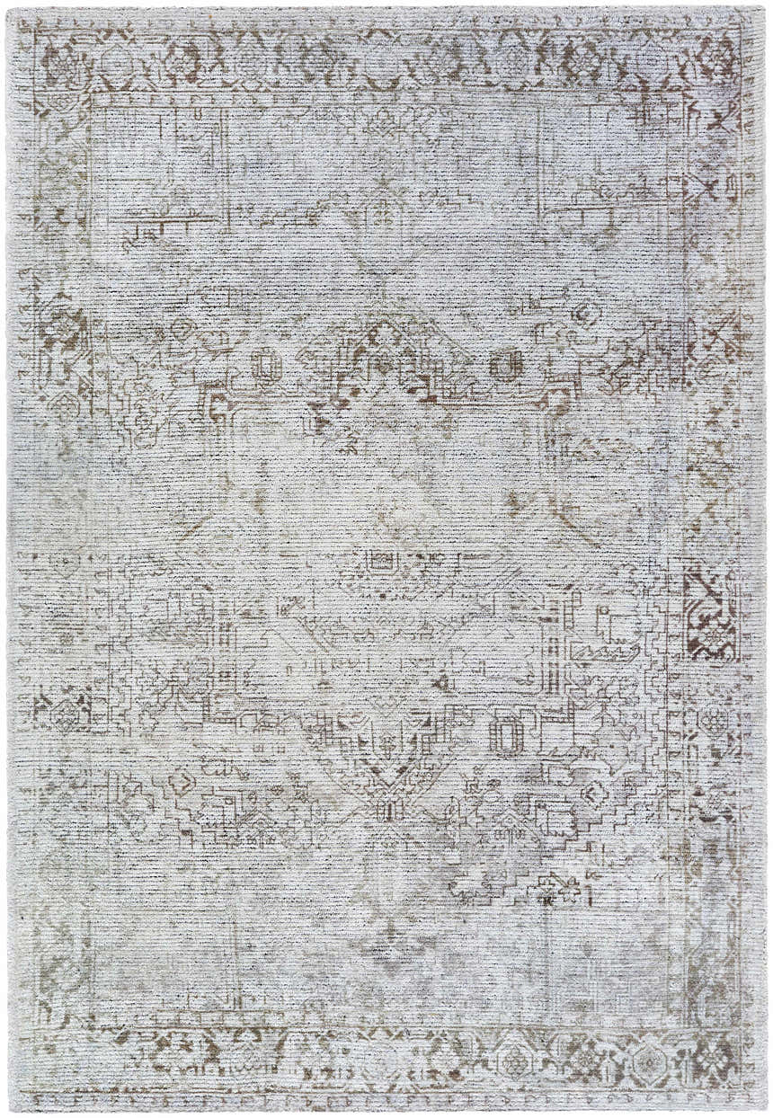 Close-up of the Clodia Area Rug. Hand-tufted polyester rug in charcoal, ivory, silver gray, and taupe with a traditional pattern. Design-Rectangle-576