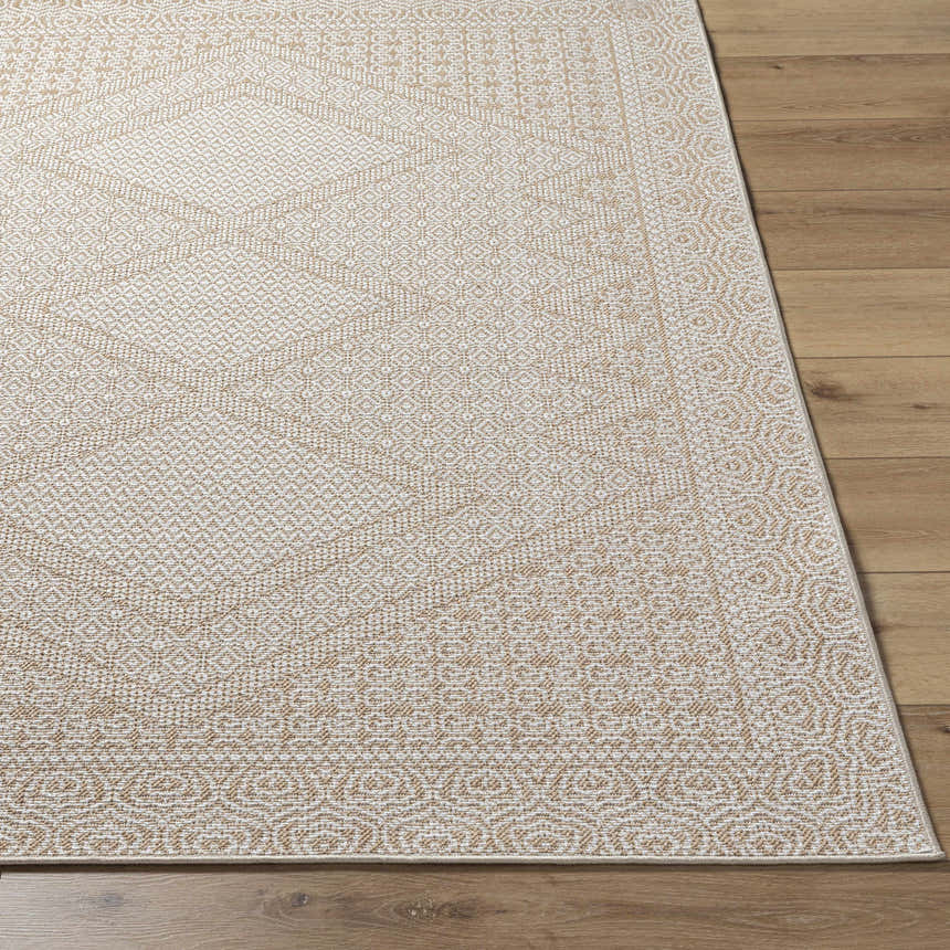Close-up of the tan and white geometric pattern on the machine woven Chaman Area Rug. Front