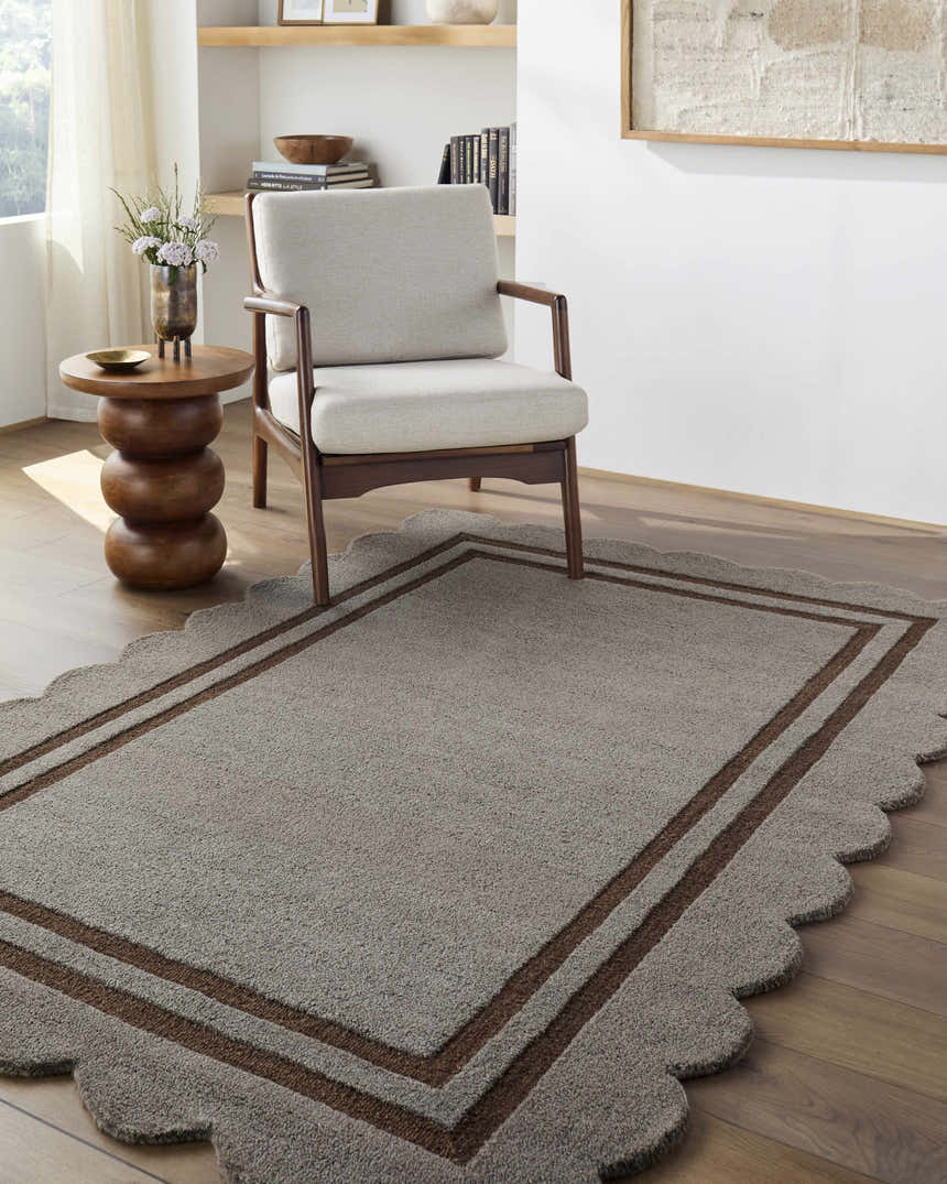 Living room scene with a Chogan Charcoal Area Rug, beige chair, and wood side table on hardwood floors. Roomscene-Rectangle
