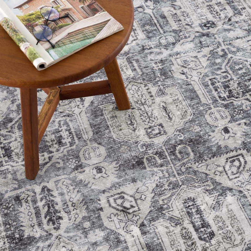Close-up of the Off White Holi-4602 Washable Area Rug featuring a vintage traditional design in beige, charcoal, and gray. Styleshot
