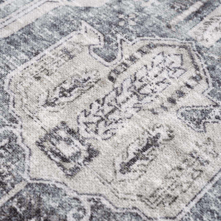 Close-up of the Off White Holi-4602 Washable Area Rug, featuring a traditional vintage pattern in beige, charcoal, and gray. Texture