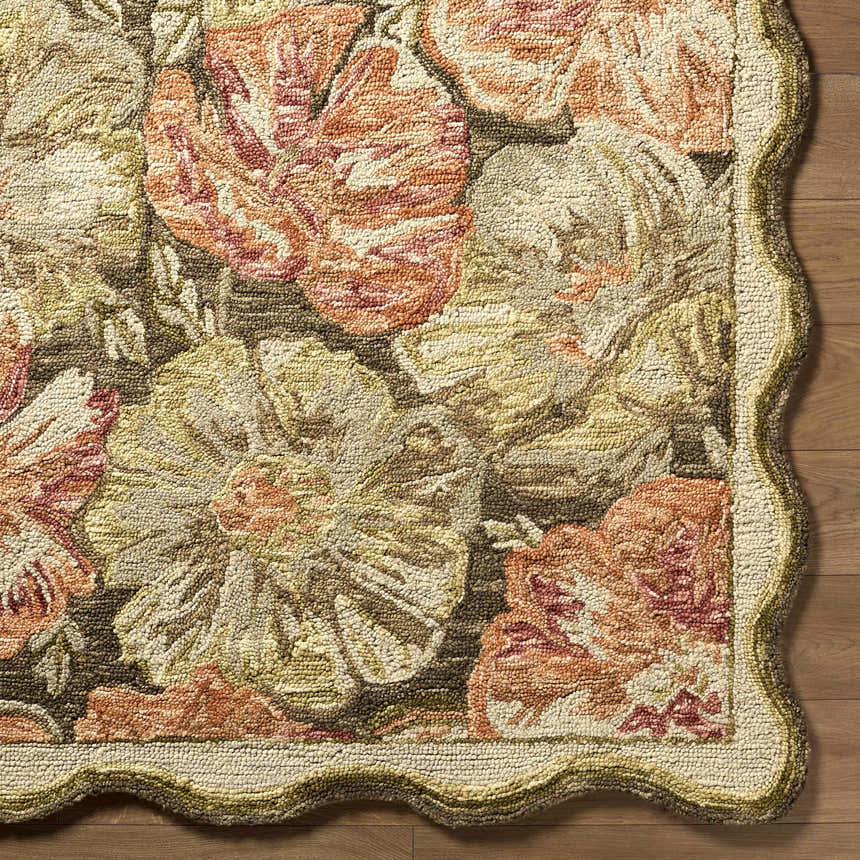 Close-up of the hand-tufted Campos Area Rug. Farmhouse style with floral design in peach, cream, and brown wool. Scalloped edge detail. Swatch
