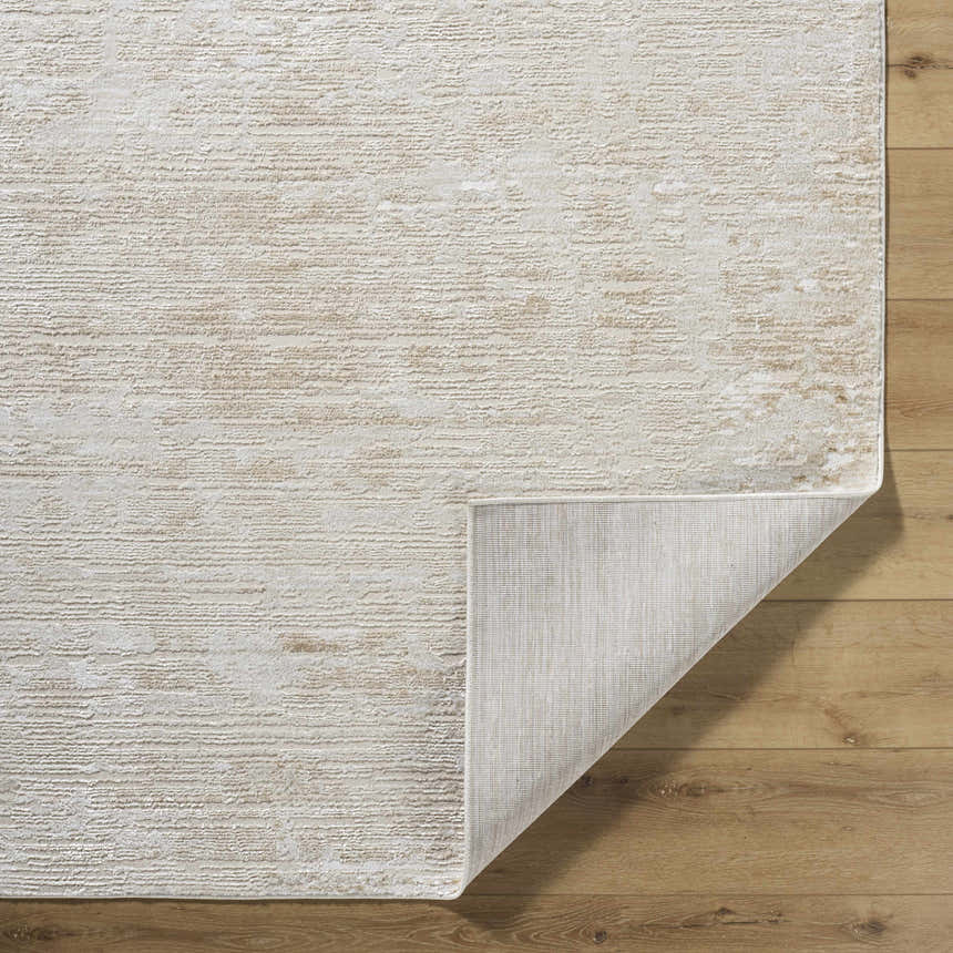 Close-up of the Candie Beige Area Rug showing its textured, contemporary design and neutral beige, cream, and tan colors. Fold