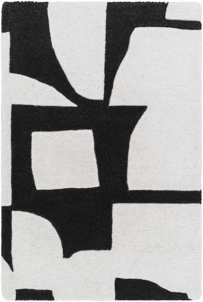 Close-up of the Celous Area Rug. Ivory wool rug with a bold, jet black abstract geometric design. Design-Rectangle-23