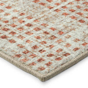 Close-up of the Dalyn Delano DA1 Linen Area Rug showing beige, spice, and light brown diamond pattern and textured edge.
