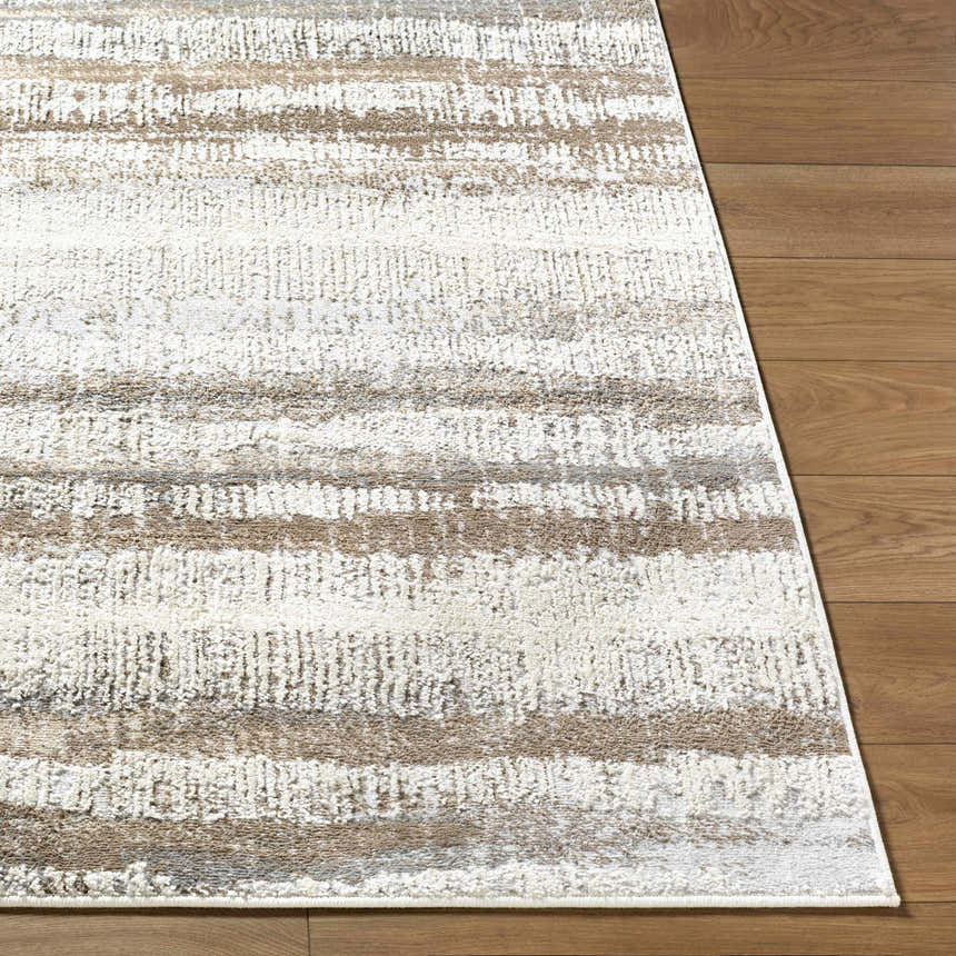 Close up of Asmara Brown area rug showing ash, pearl, and brown horizontal stripes on wood floor. Front