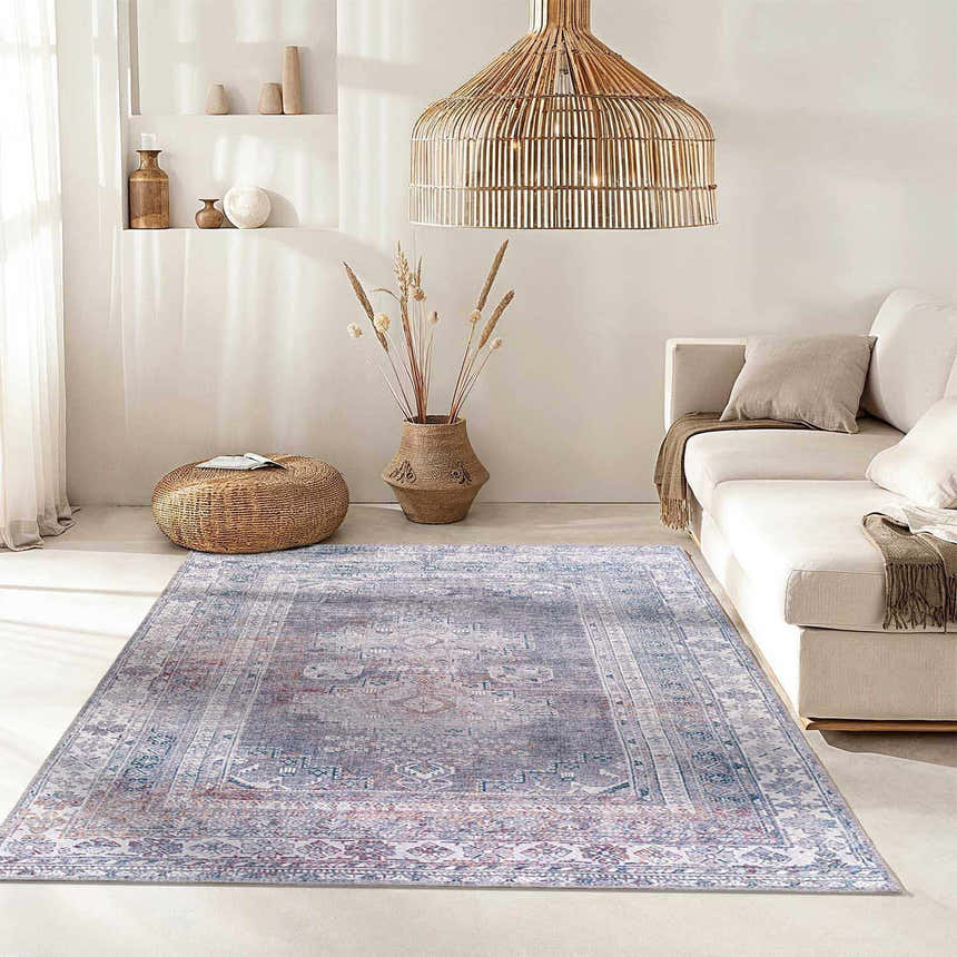 Neutral living room with a Livabliss Colin rug in charcoal, cream, and red, complementing the white sofa and woven accents. Roomscene-Rectangle