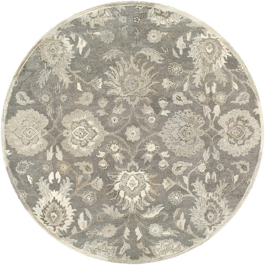 Close-up of a round Conesus 1195 rug. Hand-tufted wool rug in ivory and taupe with a traditional floral pattern. Design-Round